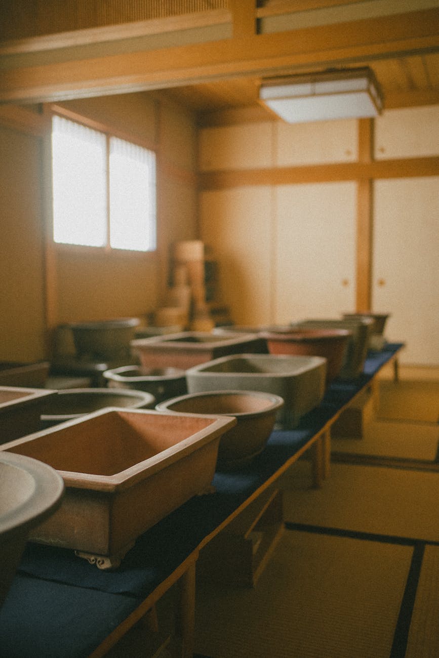 Traditional Japanese bamboo basket with intricate woven hexagonal pattern resting on wooden surface in natural daylight