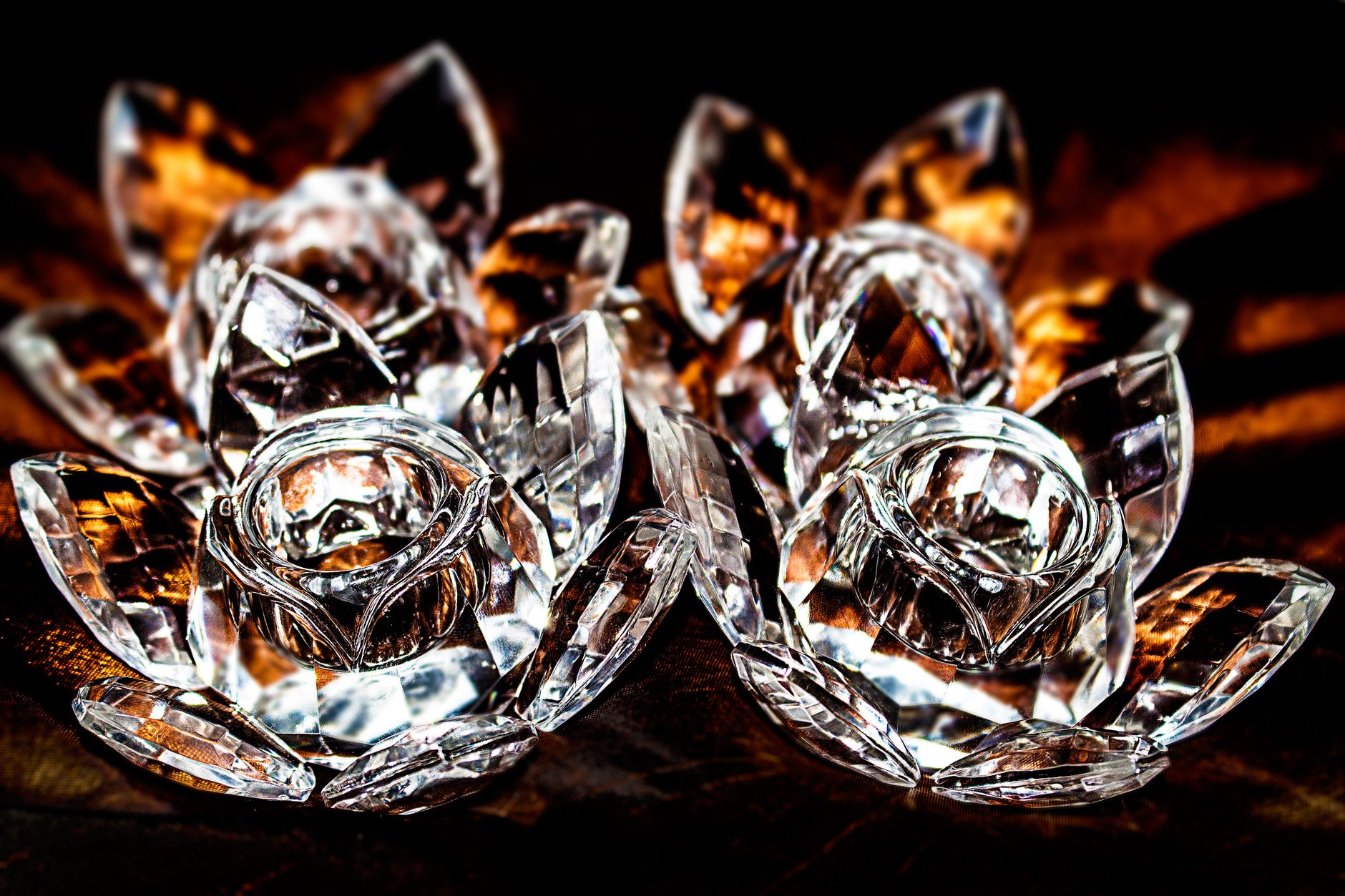 Traditional Edo kiriko cut glass displaying geometric nanako and yarai patterns with precise diagonal cuts catching light against dark background.