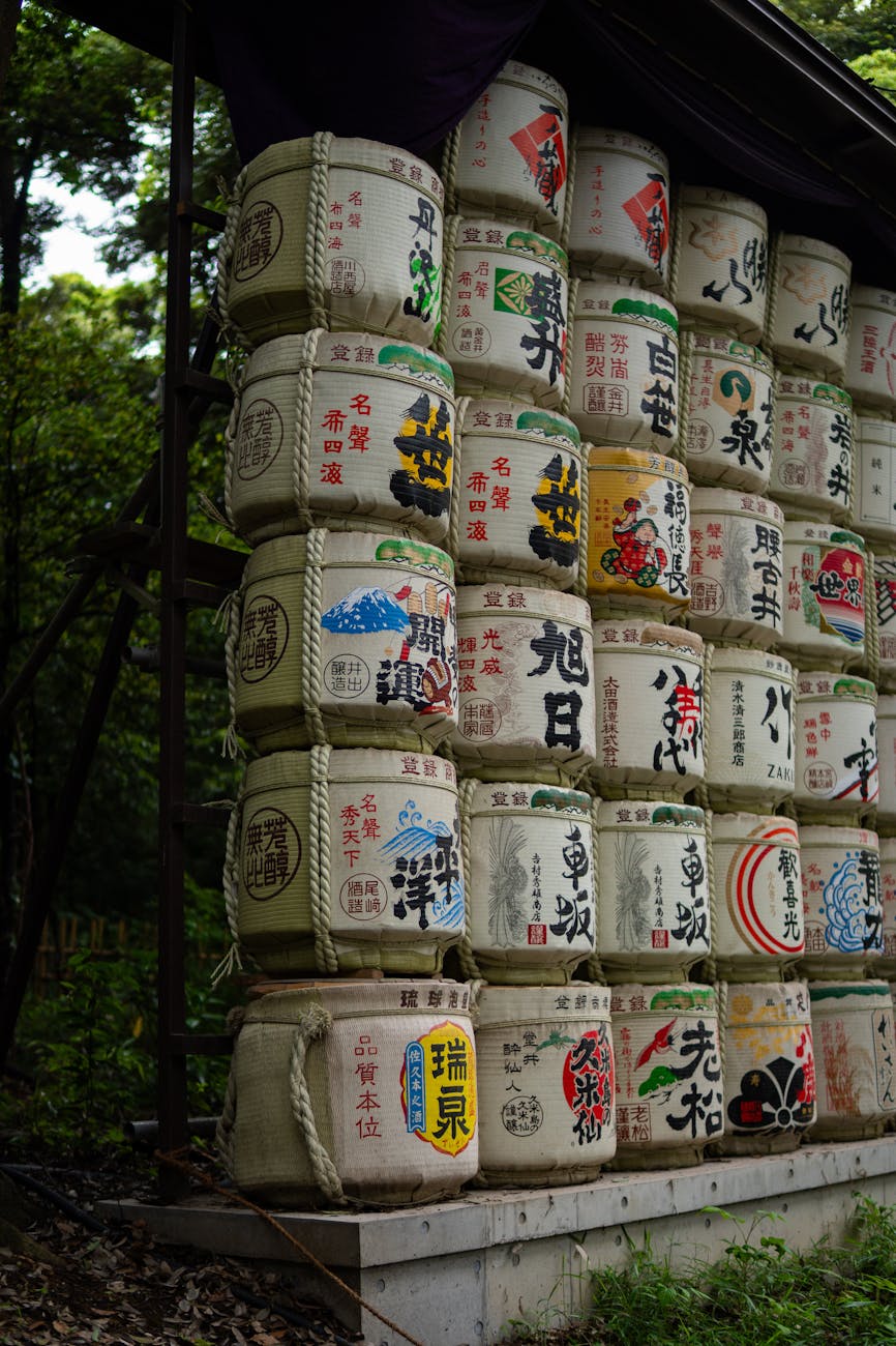 Traditional Japanese fermented foods including miso paste, soy sauce, natto, and pickled vegetables arranged on a wooden table.