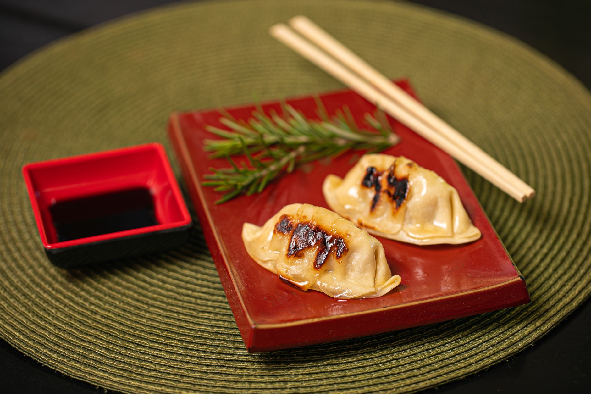 Traditional Japanese washoku meal arranged on lacquerware featuring seasonal ingredients, rice, miso soup, and pickled vegetables in harmonious presentation.