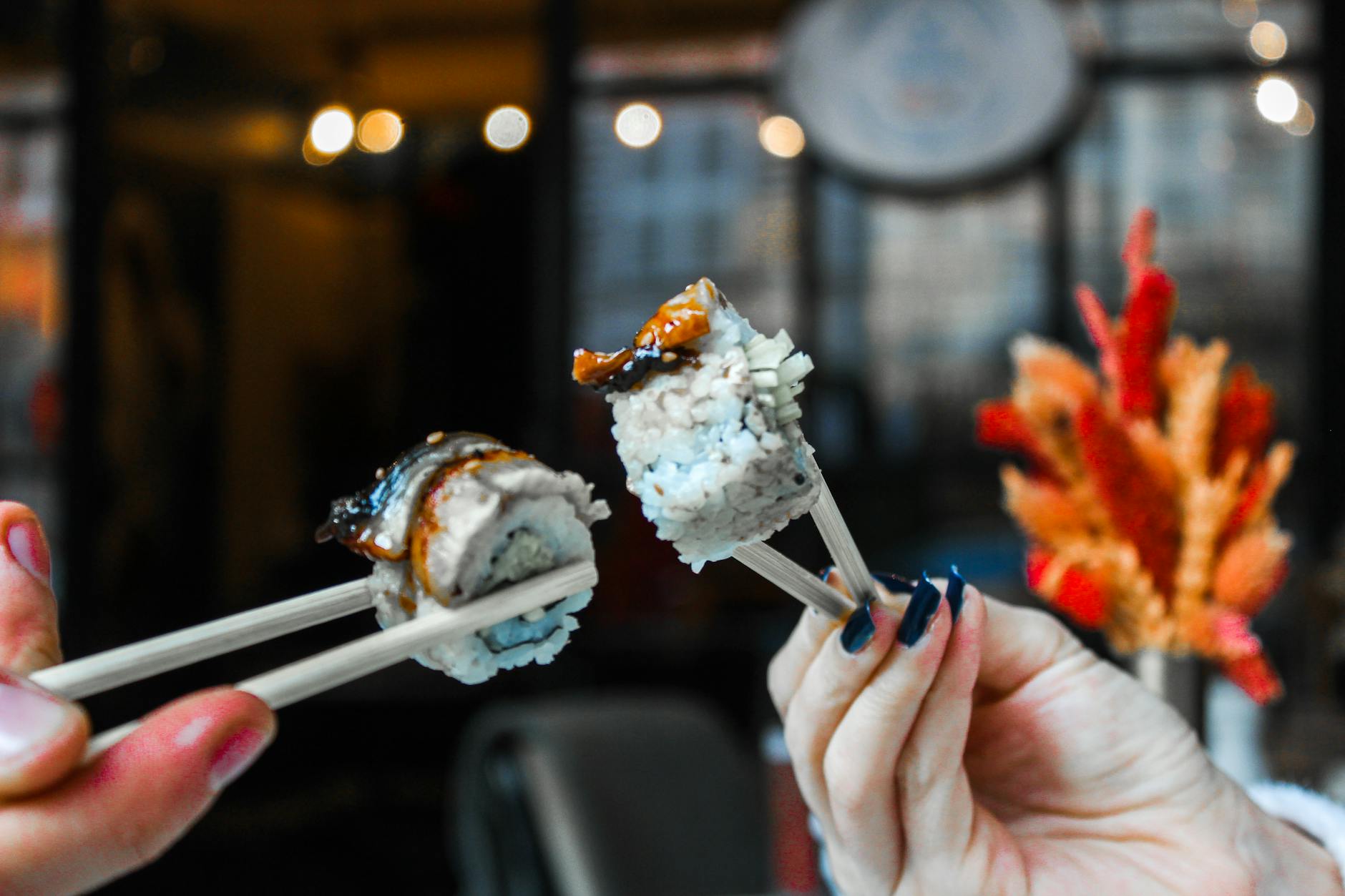 Chopsticks standing upright in a bowl of white rice, demonstrating the Japanese funeral ritual taboo.
