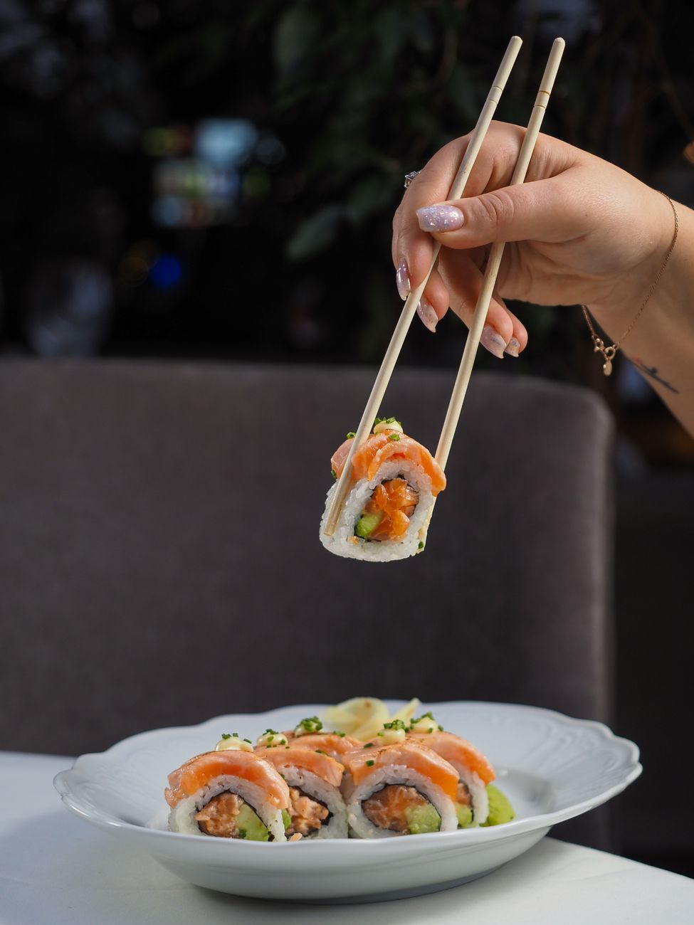 Chopsticks standing upright in a bowl of white rice, demonstrating the Japanese funeral ritual taboo.