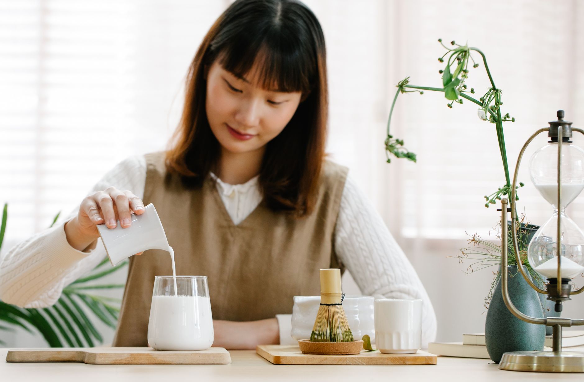 Elderly Japanese man tending to a small vegetable garden in morning light, embodying daily purpose through simple routine.