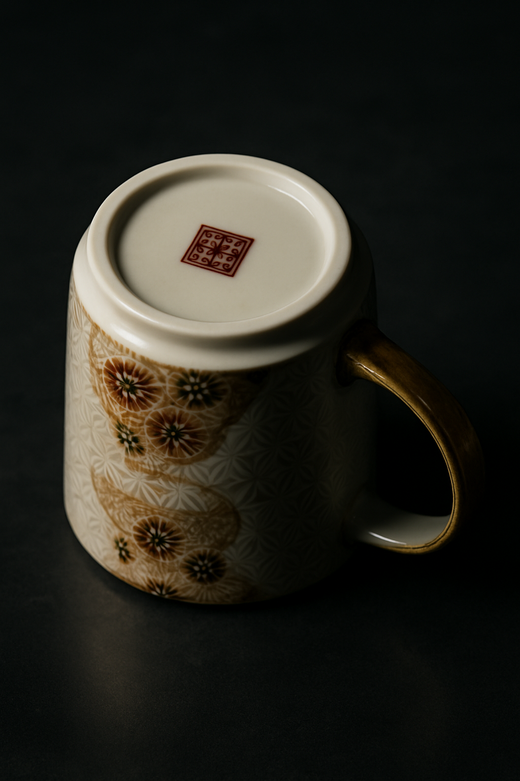 Traditional Mashiko pottery bowl with thick irregular glaze in earth tones displayed on rustic wooden surface with natural lighting.