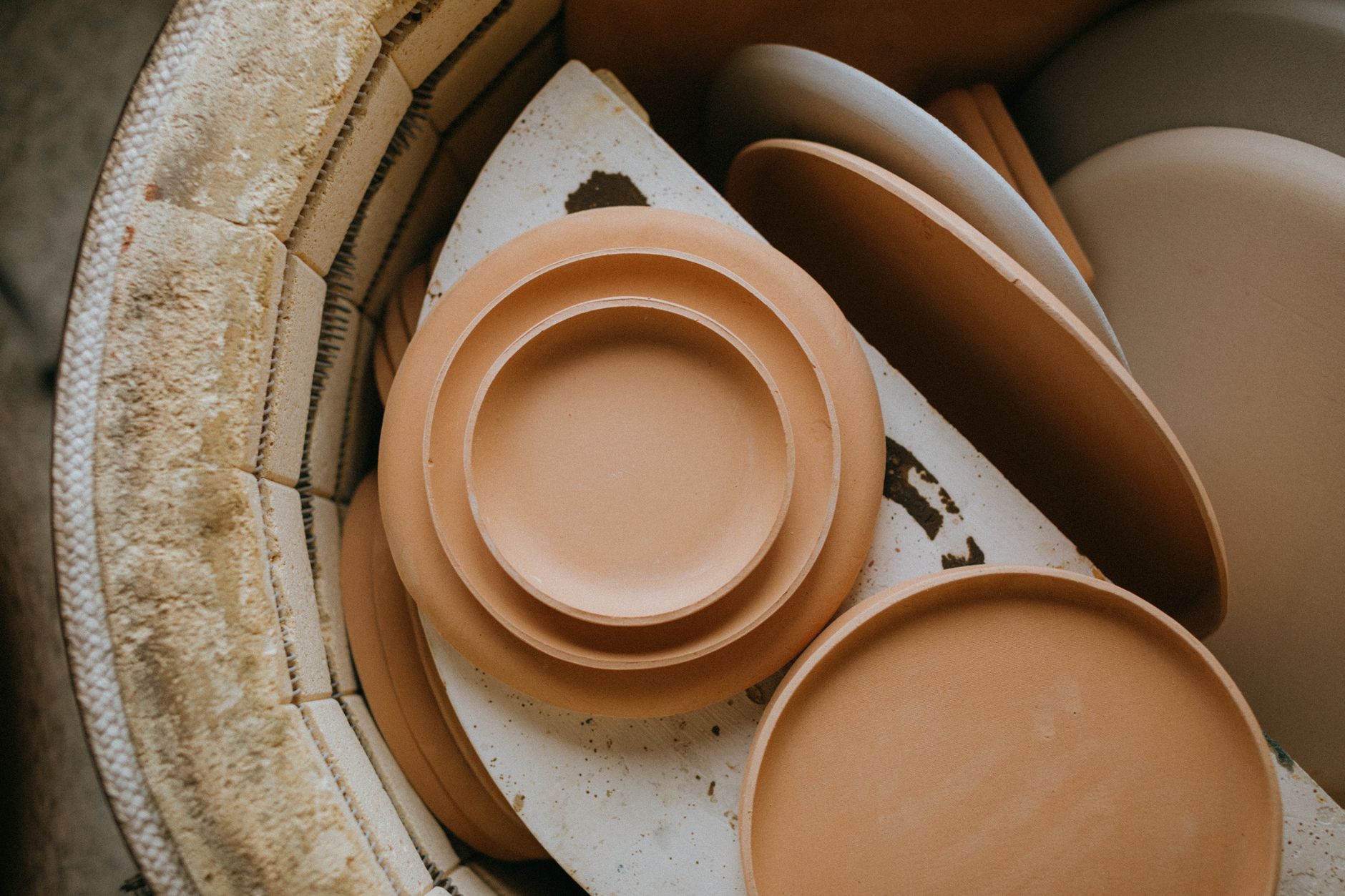 Traditional Seto ware ceramics displaying characteristic ash glaze and wheel-thrown forms from Japan's oldest pottery production center in Aichi Prefecture.