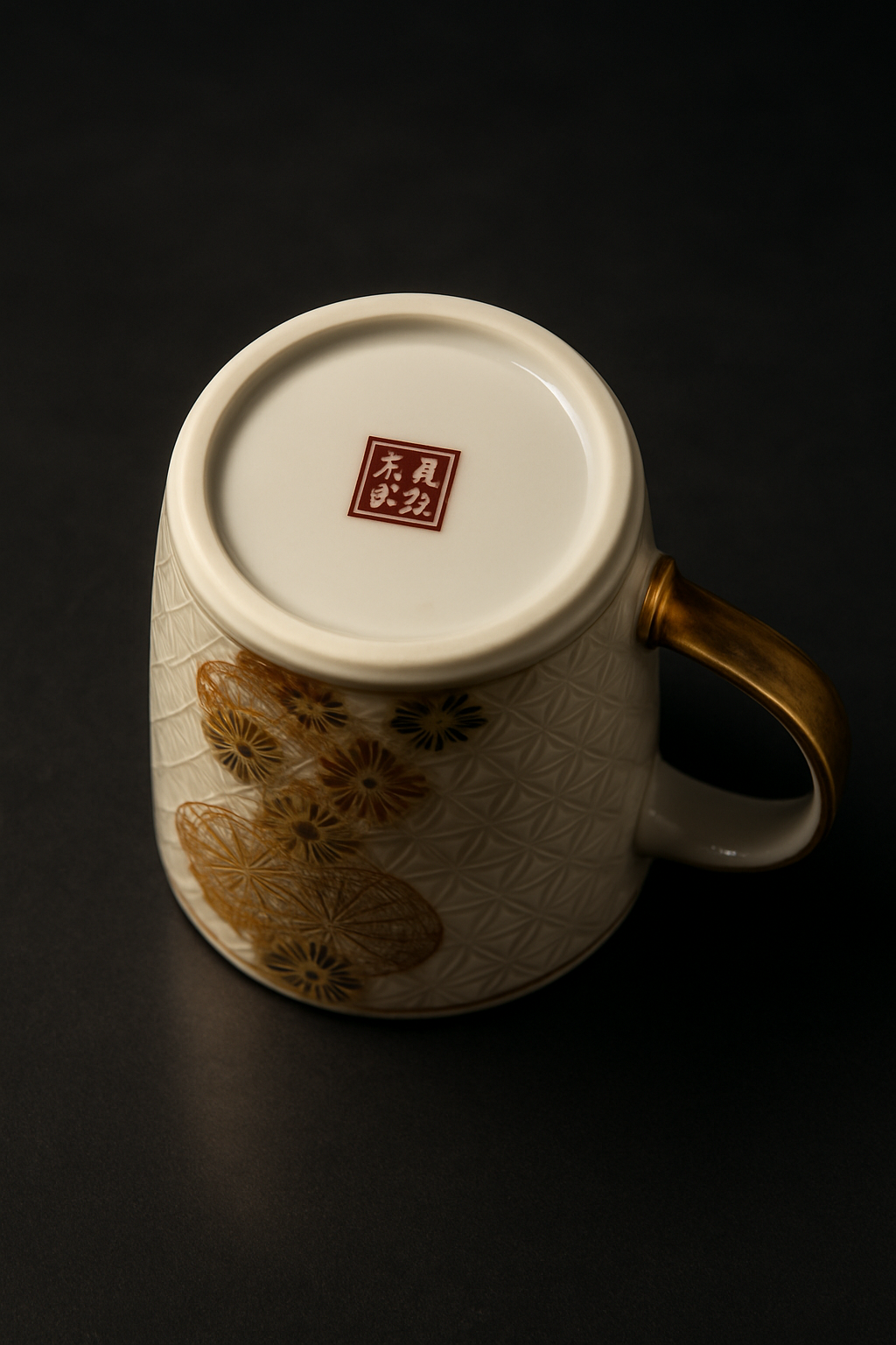 Hands gently washing a handmade Japanese ceramic bowl under running water with a soft natural sponge.