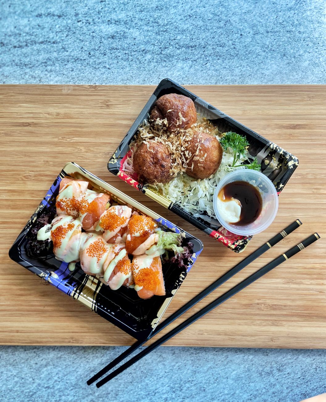 Traditional Japanese bento box displaying balanced compartments filled with rice, grilled fish, pickled vegetables, and colorful seasonal side dishes.