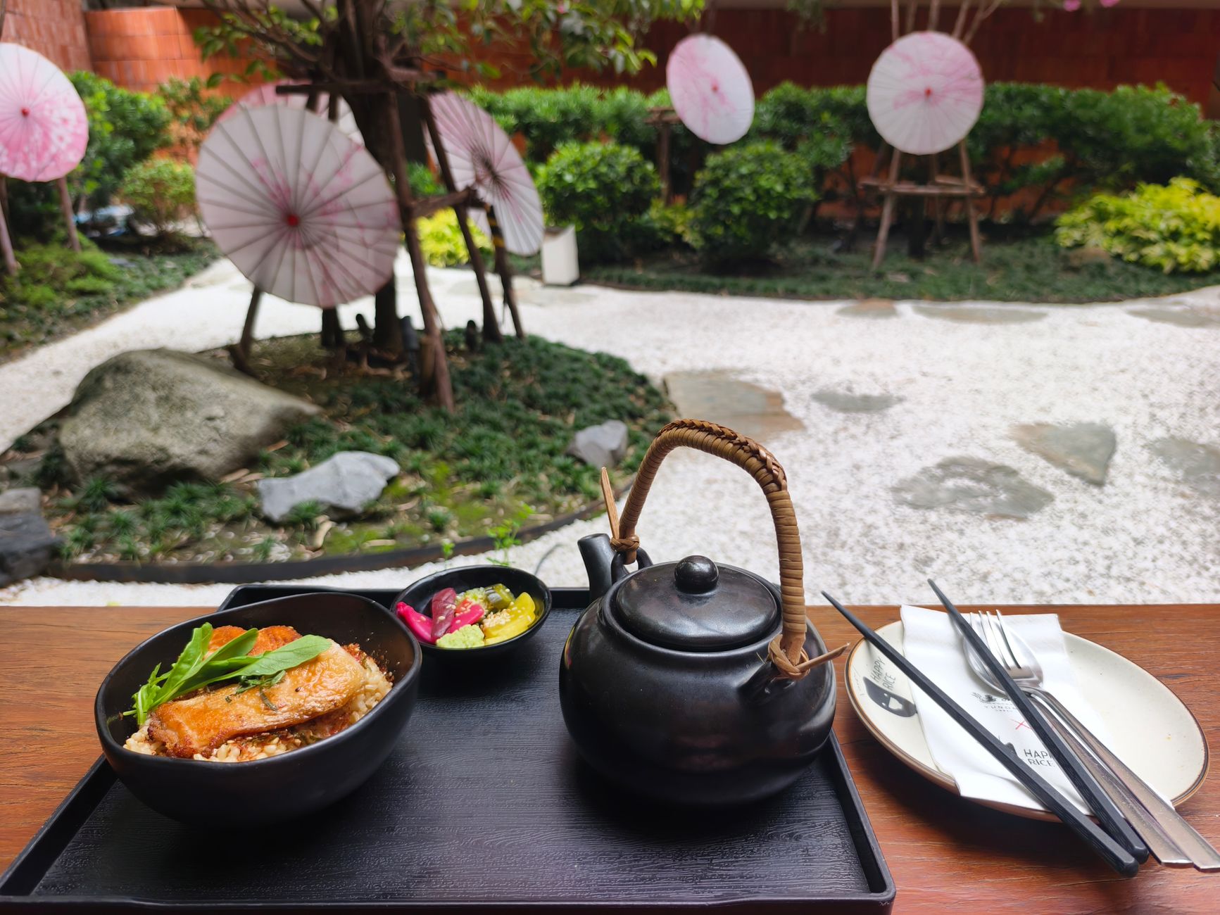 Pale celadon bowl holding delicate tofu and seasonal greens on a traditional Kyoto lacquered tray with chopsticks resting beside.