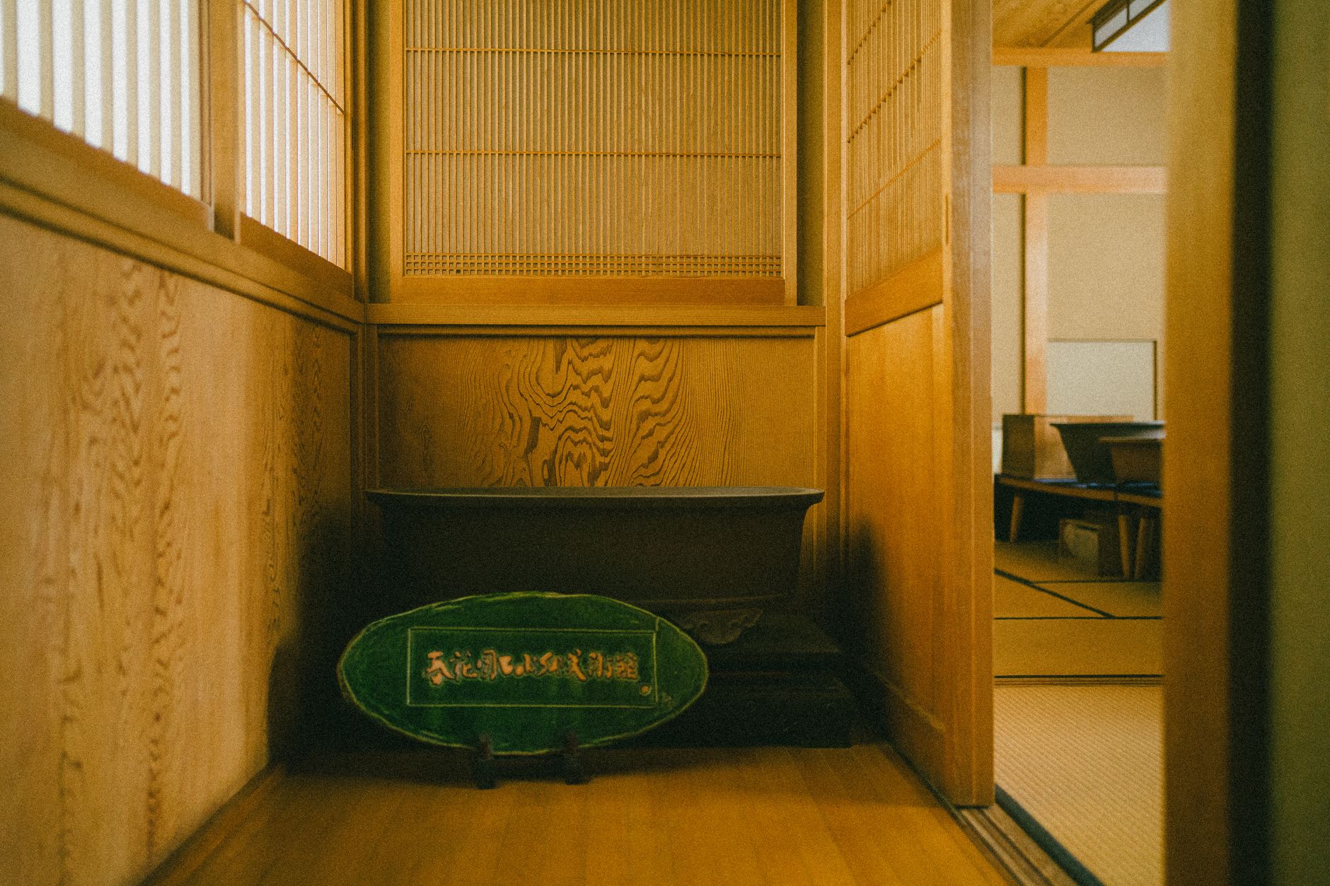 Traditional tatami mat floor in a minimalist Japanese room with low wooden furniture and natural light