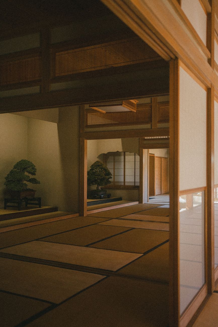 Traditional tatami mat floor in a minimalist Japanese room with low wooden furniture and natural light