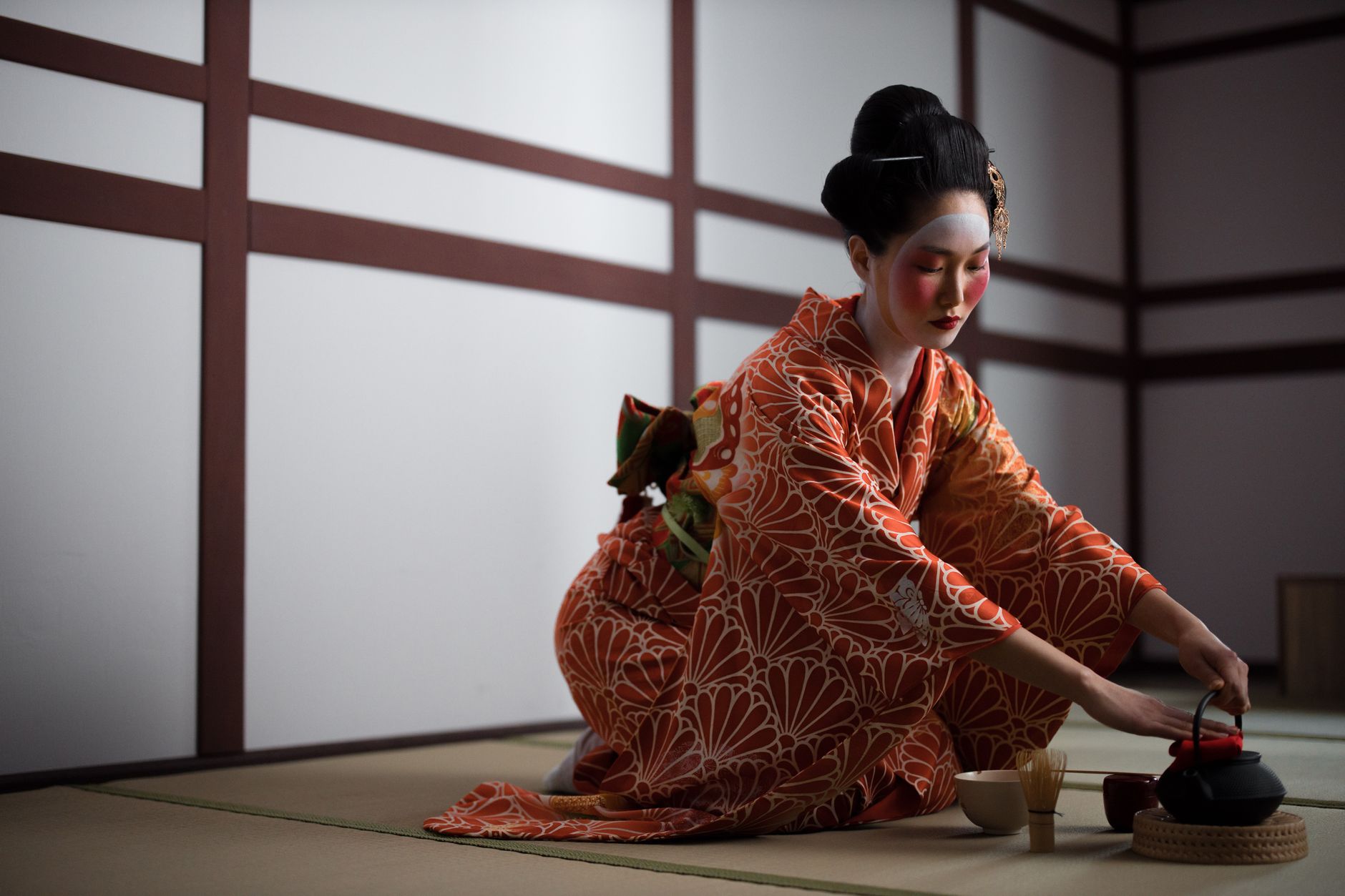 Sunlight filters through shoji screens onto a quiet tatami room where a single tea bowl rests in stillness.
